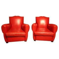 Paire d'anciens fauteuils club en cuir rouge